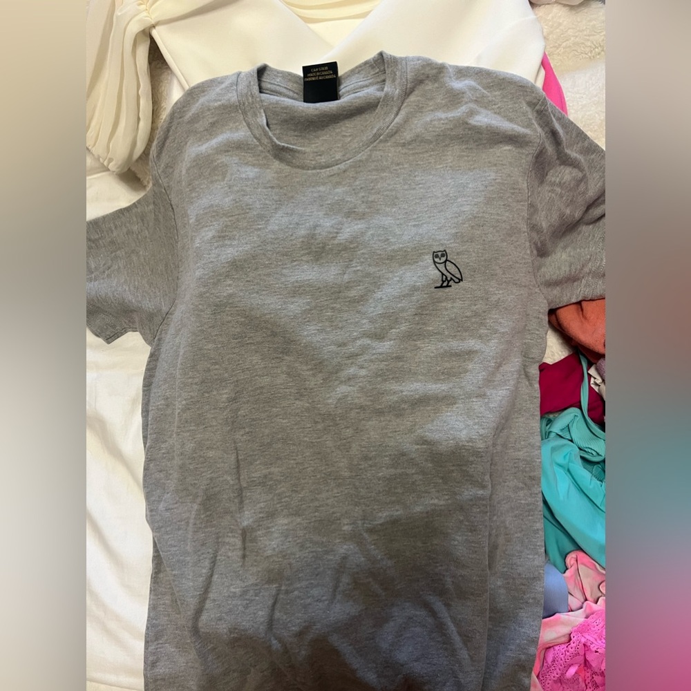 Drake’s brand OVO shirt